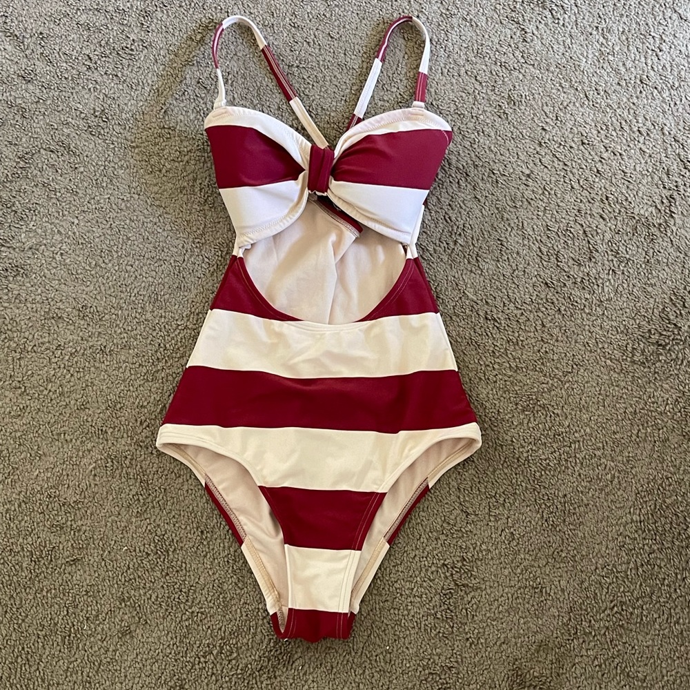 “Unique vintage” size small one piece NEVER BEEN WORN